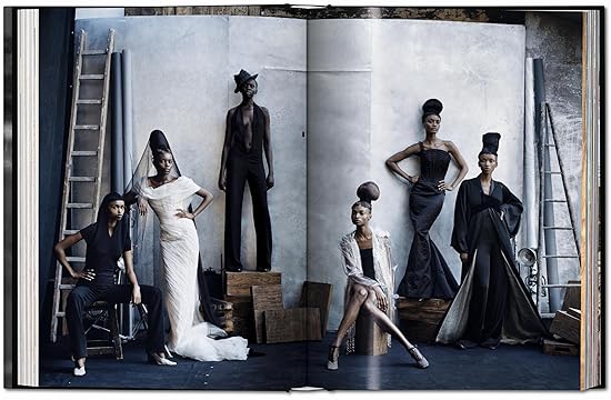1. An open book displaying a group of women dressed in elegant black dresses, showcasing their diverse styles and poses. 2. A book opened to reveal a group of women in stylish black dresses, highlighting their camaraderie and fashion choices. 3. An open book featuring a collection of women in black dresses, emphasizing their unity and distinct fashion expressions.