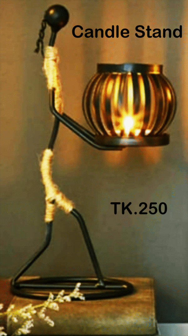 1. A candle stand holding a lit candle, casting a warm glow in a dimly lit setting. 2. A decorative candle stand featuring a single candle, illuminating its surroundings softly. 3. A simple candle stand with a burning candle, creating a cozy atmosphere in the room.